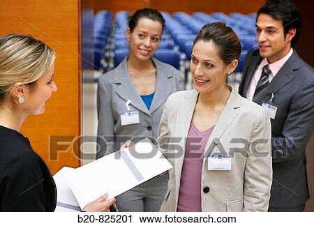 Hostess supplying documentation to conventioneers, convention center, Kursaal Center. San Sebastian, Guipuzcoa, Basque Country, Spain View Large Photo Image Stock Image - Hostess supplying documentation to conventioneers, convention center, Kursaal Center. San Sebastian, Guipuzcoa, Basque Country, Spain. Fotosearch