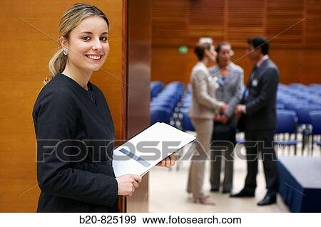 Hostess supplying documentation to conventioneers, convention center, Kursaal Center. San Sebastian, Guipuzcoa, Basque Country, Spain View Large Photo Image Stock Photo - Hostess supplying documentation to conventioneers, convention center, Kursaal Center. San Sebastian, Guipuzcoa, Basque Country, Spain. Fotosearch