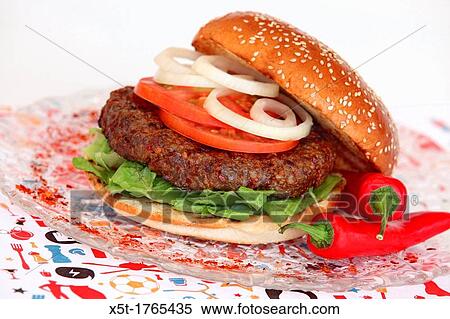 Hot and spicy Hamburger with lettuce onion and tomato View Large Photo Image Stock Photography - Hot and spicy Hamburger with lettuce onion and tomato. Fotosearch