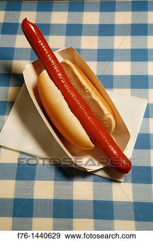 Hot dog on blue and white checkered tablecloth View Large Photo Image Stock Photo - Hot dog on blue and white checkered tablecloth. Fotosearch