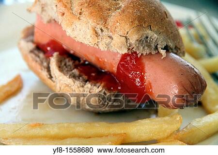 Hot dog with French fries View Large Photo Image Stock Image - Hot dog with French fries. Fotosearch