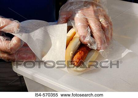 Hot dogs being prepared on a grill for sale to the public View Large Photo Image Stock Photography - Hot dogs being prepared on a grill for sale to the public. Fotosearch