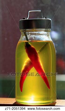 Hot peppers in oil,. View Large Photo Image Picture - Hot peppers in oil,.. Fotosearch
