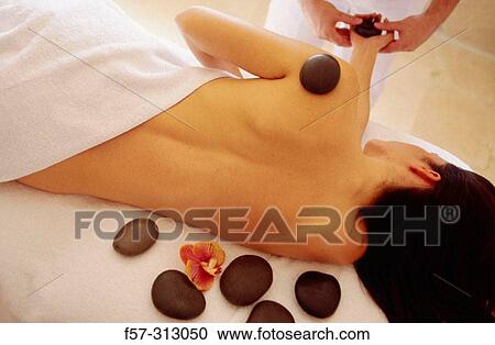 Hot stone therapy View Large Photo Image Stock Image - Hot stone therapy. Fotosearch