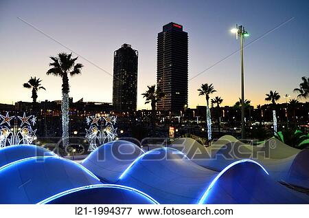 Hotel Arts, Mapfre Tower, Port Ol? mpic at sundown. Palm trees, neon lights, silhouettes. Port of Barcelona, Barcelona, Catalonia, Spain. View Large Photo Image Stock Photo - Hotel Arts, Mapfre Tower, Port Ol? mpic at sundown. Palm trees, neon lights, silhouettes. Port of Barcelona, Barcelona, Catalonia, Spain.. Fotosearch