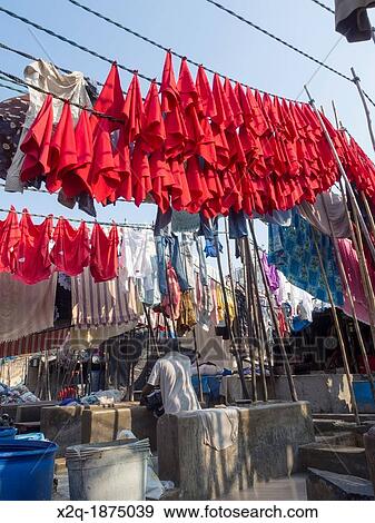 Stock Photo - Hotel cloth napkins hanging to dry at Dhobi Ghat an outdoor laundry facility in Mumbai India. Fotosearch
