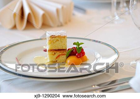 Hotel restaurant in Venice, cream cake with apricot and currant. View Large Photo Image Picture - Hotel restaurant in Venice, cream cake with apricot and currant.. Fotosearch