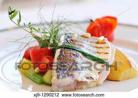 Hotel restaurant in Venice, sea bass, potato and tomato. View Large Photo Image Stock Image - Hotel restaurant in Venice, sea bass, potato and tomato.. Fotosearch