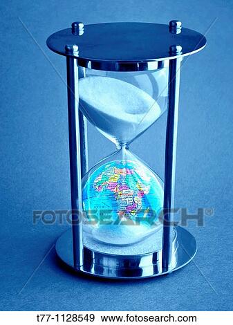 Hourglass with globe View Large Photo Image Stock Photo - Hourglass with globe. Fotosearch