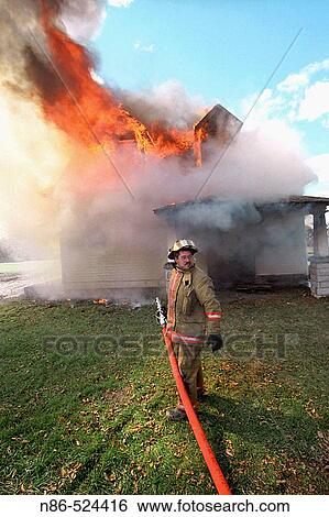 House fire, firefighter View Large Photo Image Stock Photograph - House fire, firefighter. Fotosearch