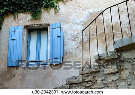 Stock Photo - House of Gordes village, labeled The Most Beautiful Villages of France, Vaucluse department, Provence-Alpes-Cote d'Azur region. France.. Fotosearch