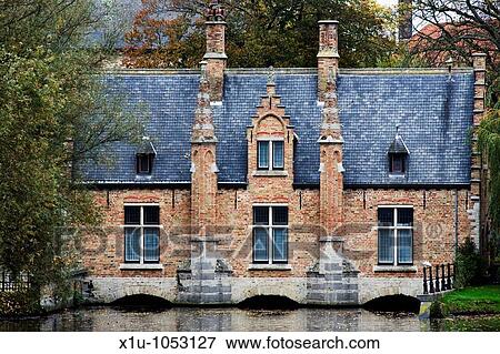 Stock Photo - House on the southern bridge at Minnewater Bruges Belgium. Fotosearch