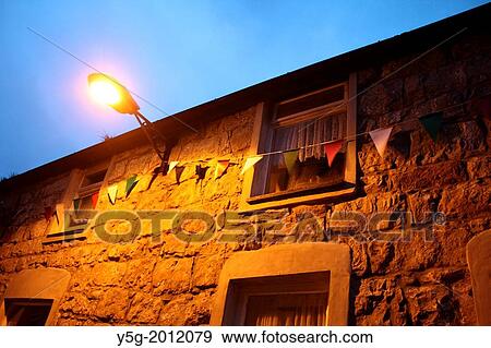 house with carnival flags at night in caernarfon wales great britain uk View Large Photo Image Stock Photo - house with carnival flags at night in caernarfon wales great britain uk. Fotosearch