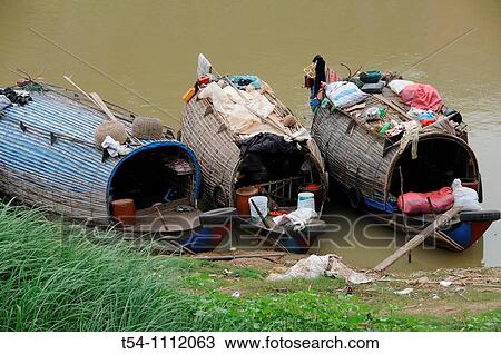 Stock Image - Houseboats on a tributary of the Mekong in Battambang. Fotosearch