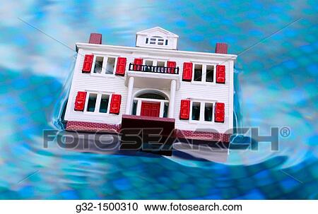 Stock Image - House/mortgage underwater, economic crisis. Fotosearch