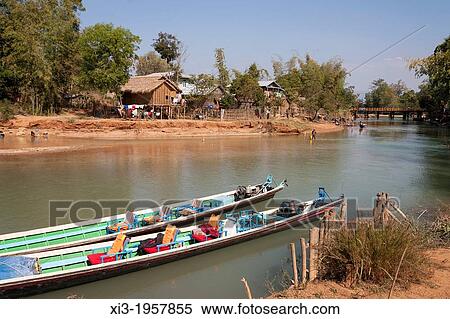 Stock Photography - Houses beside a tributary to Inle Lake, near Indein and Nyaung Ohak villages, Shan State, Myanmar, (Burma).. Fotosearch