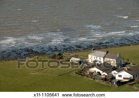 houses near cliffs on the coast of Cardigan Bay west wales UK View Large Photo Image Stock Image - houses near cliffs on the coast of Cardigan Bay west wales UK. Fotosearch
