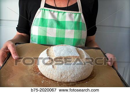 Housewife with homemade bread to bake View Large Photo Image Stock Photo - Housewife with homemade bread to bake. Fotosearch