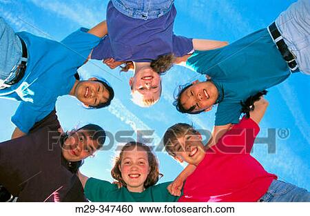 Stock Image - Huddle of kids. Fotosearch
