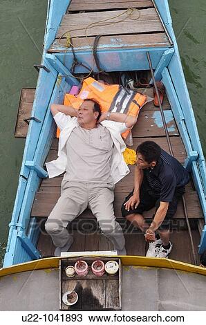 Hue (Vietnam): men on a boat along the Huong (? Perfume? ) River View Large Photo Image Stock Image - Hue (Vietnam): men on a boat along the Huong (? Perfume? ) River. Fotosearch