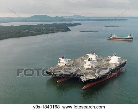 Stock Photo - Huge transport ship carrying parts and supplies for construction of Sungai Johor Bridge, which opened on June 10, 2011 as the longest River bridge in Malaysia. Fotosearch