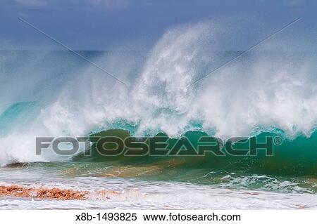 Stock Photography - HUGE waves breaking on the beach at Ascension Island in the Tropical Atlantic Ocean. Fotosearch