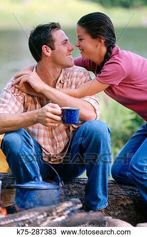 hugging by the campfire View Large Photo Image Stock Image - hugging by the campfire. Fotosearch