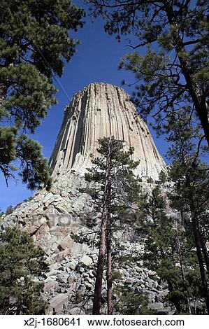 Hulett, Wyoming - Devils Tower National Monument The volanic tower rises 1200 feet above the surrounding plains It was America's first national monument, established by President Theodore Roosevelt in 1906 under the Antiquities Act View Large Photo Image Stock Image - Hulett, Wyoming - Devils Tower National Monument The volanic tower rises 1200 feet above the surrounding plains It was America's first national monument, established by President Theodore Roosevelt in 1906 under the Antiquities Act. Fotosearch