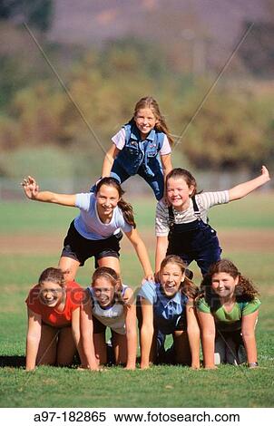Stock Photography - Human pyramid of teen girls. Fotosearch