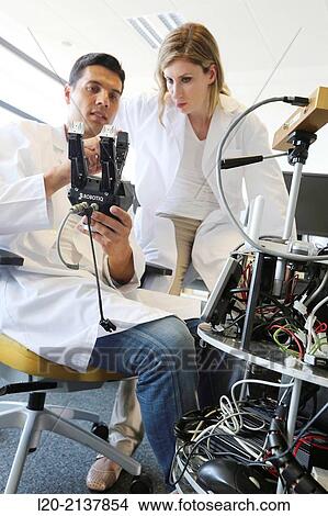 Humanoid robot for automotive assembly tasks in collaboration with people and and LWR robot, using haptic teleoperation with force feedback. View Large Photo Image Picture - Humanoid robot for automotive assembly tasks in collaboration with people and and LWR robot, using haptic teleoperation with force feedback.. Fotosearch