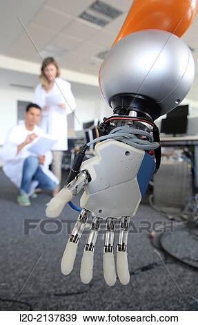 Stock Photo - Humanoid robot for automotive assembly tasks in collaboration with people and and LWR robot, using haptic teleoperation with force feedback.. Fotosearch