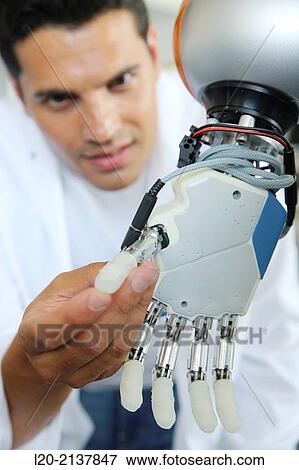 Humanoid robot for automotive assembly tasks in collaboration with people and and LWR robot, using haptic teleoperation with force feedback. View Large Photo Image Stock Photo - Humanoid robot for automotive assembly tasks in collaboration with people and and LWR robot, using haptic teleoperation with force feedback.. Fotosearch