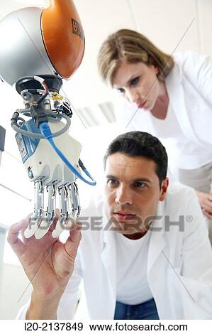 Humanoid robot for automotive assembly tasks in collaboration with people and and LWR robot, using haptic teleoperation with force feedback. View Large Photo Image Stock Photo - Humanoid robot for automotive assembly tasks in collaboration with people and and LWR robot, using haptic teleoperation with force feedback.. Fotosearch