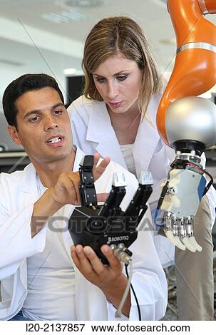 Stock Photo - Humanoid robot for automotive assembly tasks in collaboration with people and and LWR robot, using haptic teleoperation with force feedback.. Fotosearch