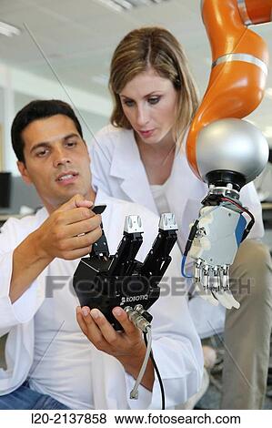 Humanoid robot for automotive assembly tasks in collaboration with people and and LWR robot, using haptic teleoperation with force feedback. View Large Photo Image Stock Photo - Humanoid robot for automotive assembly tasks in collaboration with people and and LWR robot, using haptic teleoperation with force feedback.. Fotosearch