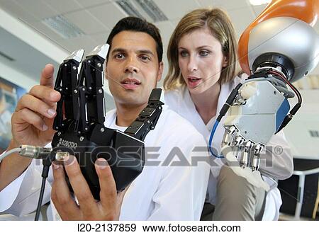 Humanoid robot for automotive assembly tasks in collaboration with people and and LWR robot, using haptic teleoperation with force feedback. View Large Photo Image Stock Photo - Humanoid robot for automotive assembly tasks in collaboration with people and and LWR robot, using haptic teleoperation with force feedback.. Fotosearch