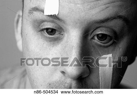 Humor, eyes taped open View Large Photo Image Picture - Humor, eyes taped open. Fotosearch