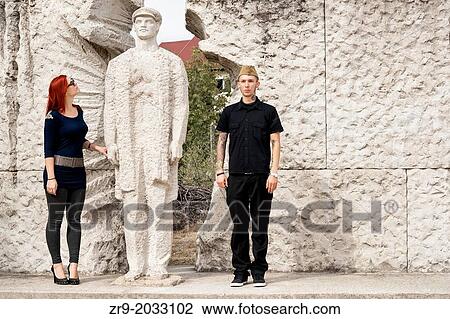 Hungarian man and woman visiting Memento Statue Park in Budapest, Hungary. View Large Photo Image Stock Image - Hungarian man and woman visiting Memento Statue Park in Budapest, Hungary.. Fotosearch