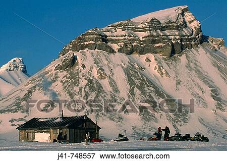 Hunters? cabin skidoos outside Ny Alesund to Longyearbyen traverse Spitsbergen Island Svalbard Norwegian Arctic View Large Photo Image Stock Photo - Hunters? cabin skidoos outside Ny Alesund to Longyearbyen traverse Spitsbergen Island Svalbard Norwegian Arctic. Fotosearch