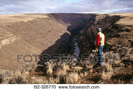 Stock Image - Hunting upland birds. Chukar hunting. Owyhee Canyon. Oregon. USA. Fotosearch
