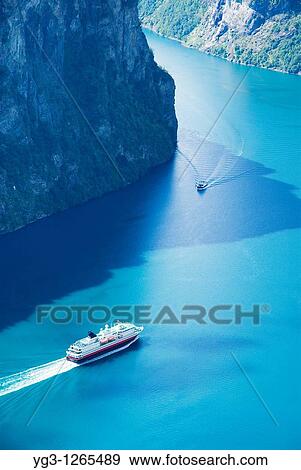 Hurtigruten coastal ferry in Geirangerfjord, Geiranger, Norway View Large Photo Image Stock Photo - Hurtigruten coastal ferry in Geirangerfjord, Geiranger, Norway. Fotosearch
