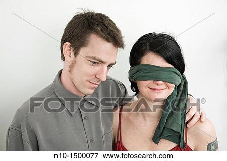 Husband and his blindfolded wife View Large Photo Image Stock Photo - Husband and his blindfolded wife. Fotosearch