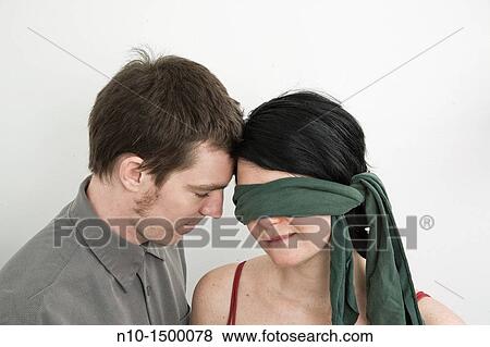 Husband and his blindfolded wife View Large Photo Image Stock Photo - Husband and his blindfolded wife. Fotosearch