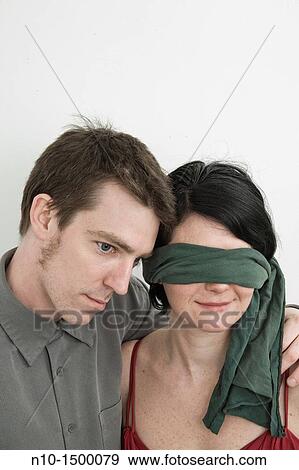 Husband and his blindfolded wife View Large Photo Image Stock Photo - Husband and his blindfolded wife. Fotosearch