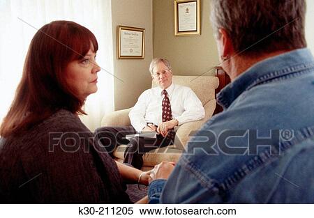 Husband and wife in therapy with counselor View Large Photo Image Stock Photography - Husband and wife in therapy with counselor. Fotosearch