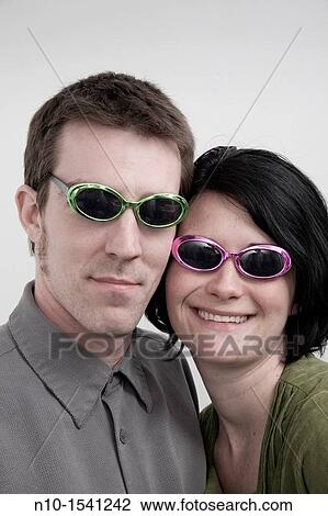 Husband and wife wearing sunglasses View Large Photo Image Stock Image - Husband and wife wearing sunglasses. Fotosearch