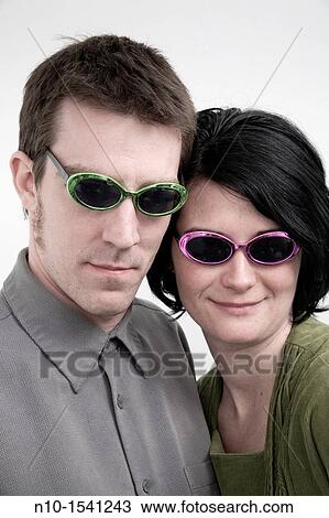 Husband and wife wearing sunglasses View Large Photo Image Stock Image - Husband and wife wearing sunglasses. Fotosearch