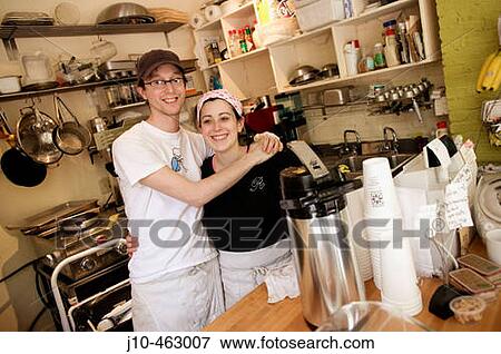 Stock Photo - Husband & wife coffee shop business, both age 28, Boston, Massachusetts. USA.. Fotosearch