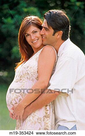 husband with his pregnant wife on the beach View Large Photo Image Picture - husband with his pregnant wife on the beach. Fotosearch