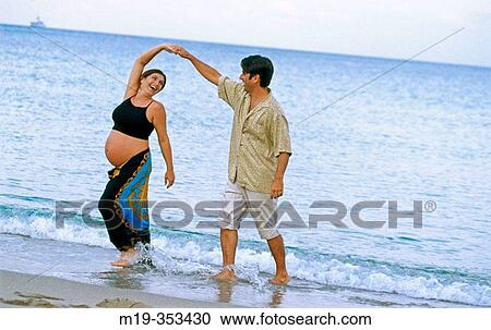 husband with his pregnant wife on the beach View Large Photo Image Stock Image - husband with his pregnant wife on the beach. Fotosearch